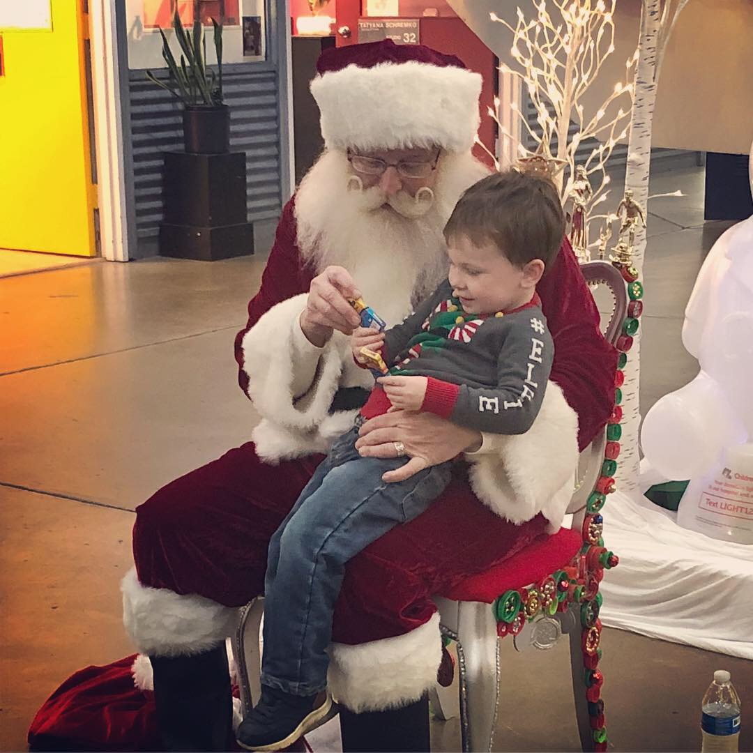 Santa Claus sitting with a young boy