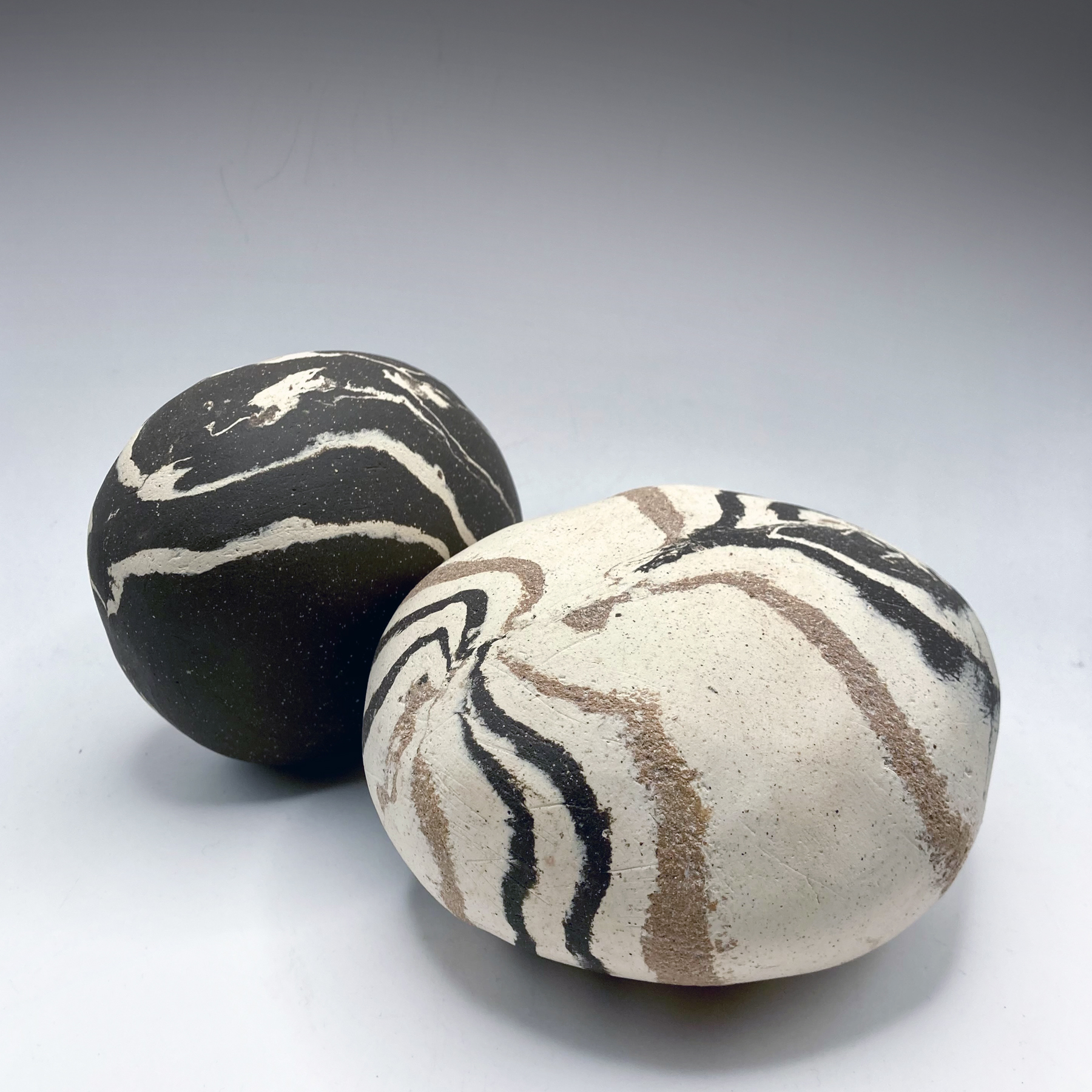 marbled stone forms in porcelain and stoneware
