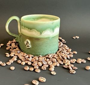 espresso cup with spashy green glaze