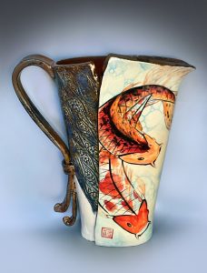 pitcher painted with orange koi fish
