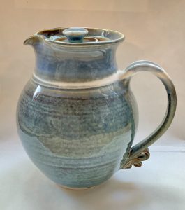 Blue variegated ceramic pitcher