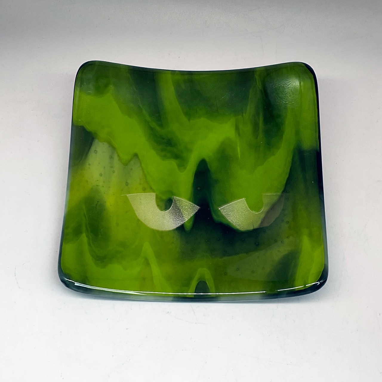 green marbled glass dish with eyes